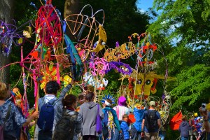 The carnival procession at Larmer Tree Festival near Salisbury